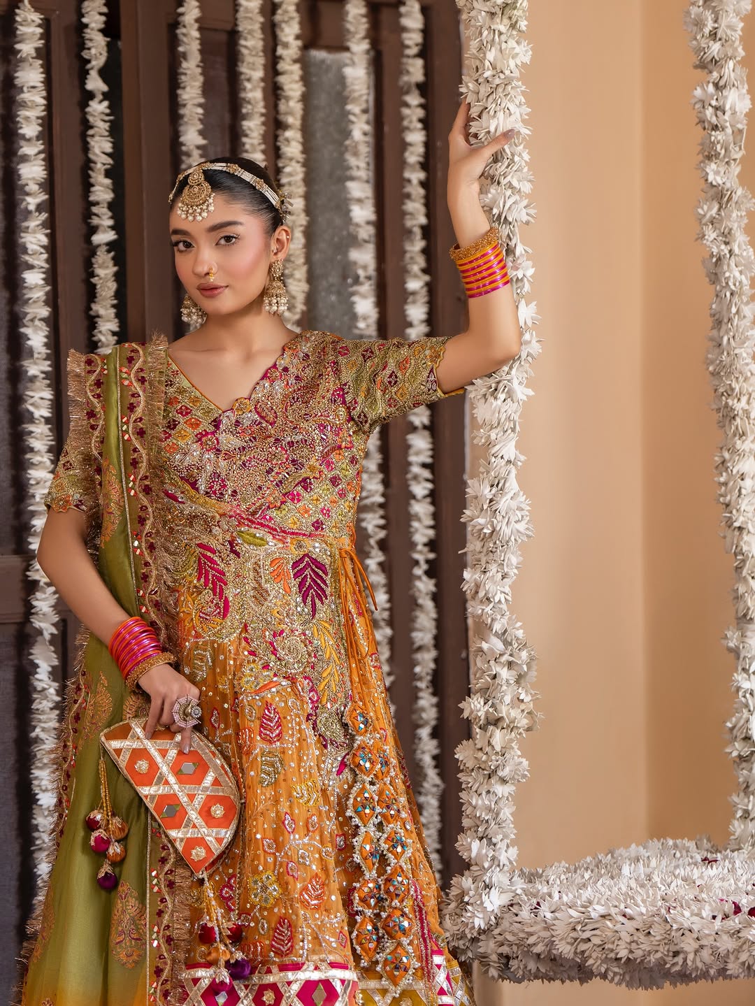 Gulnar Mehndi Lehenga – Mustard Orange Angrakha & Fuchsia Pink Bridal Lehenga Choli with Gota Work
