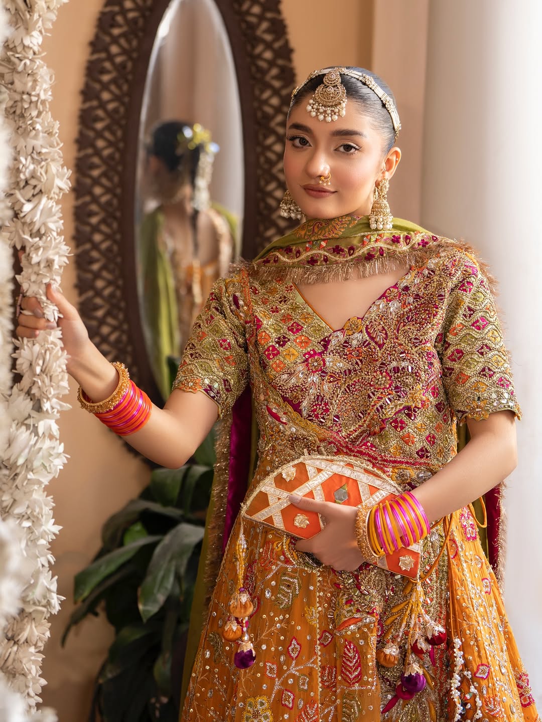 Gulnar Mehndi Lehenga – Mustard Orange Angrakha & Fuchsia Pink Bridal Lehenga Choli with Gota Work