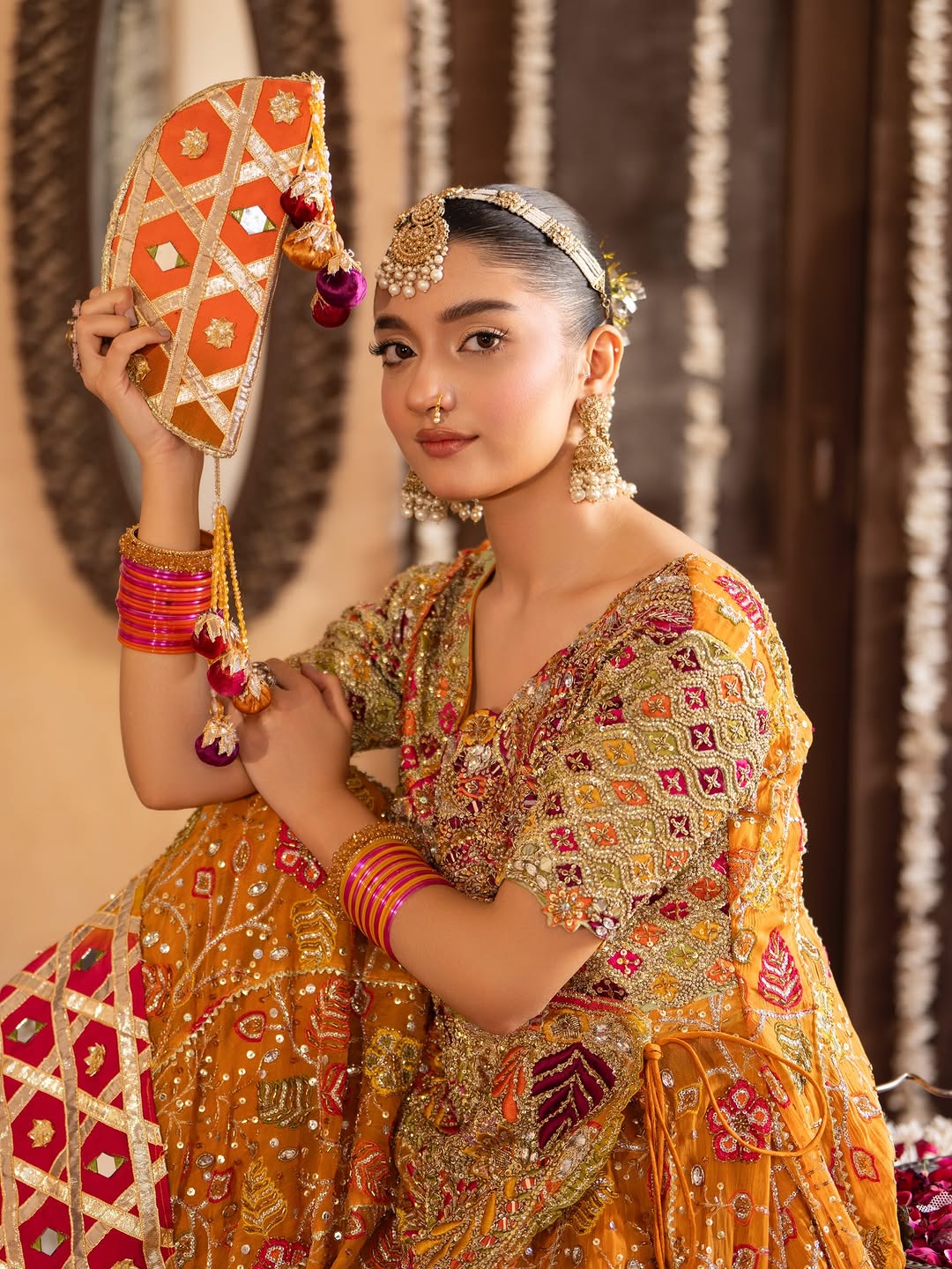 Gulnar Mehndi Lehenga – Mustard Orange Angrakha & Fuchsia Pink Bridal Lehenga Choli with Gota Work